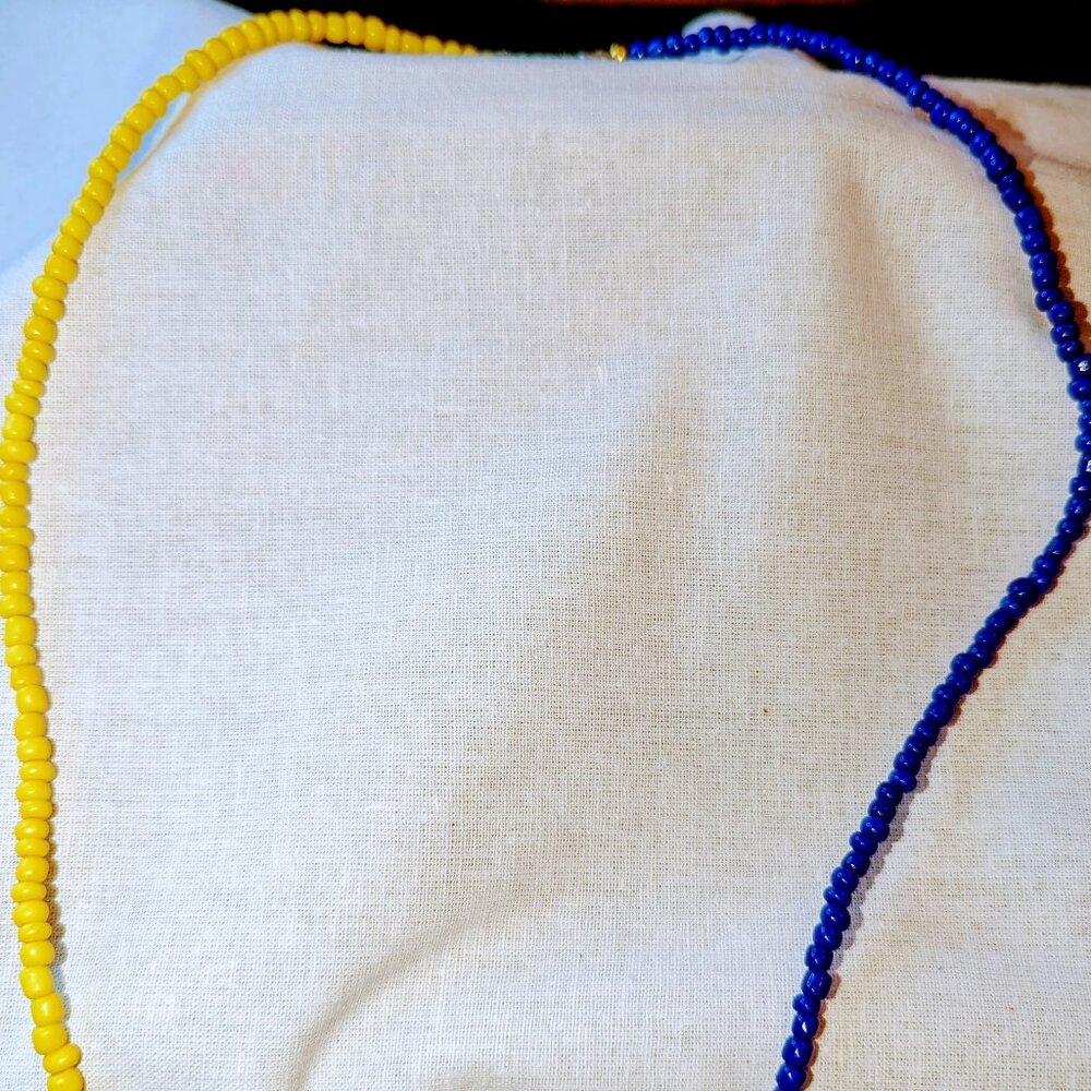 New long double color necklace made with gold yellow and royal blue beads.
